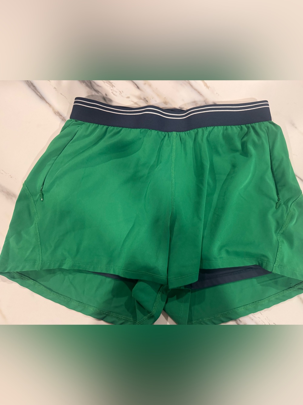 The Upside Green Shorts with Navy Stripe Waistband and navy under shorts